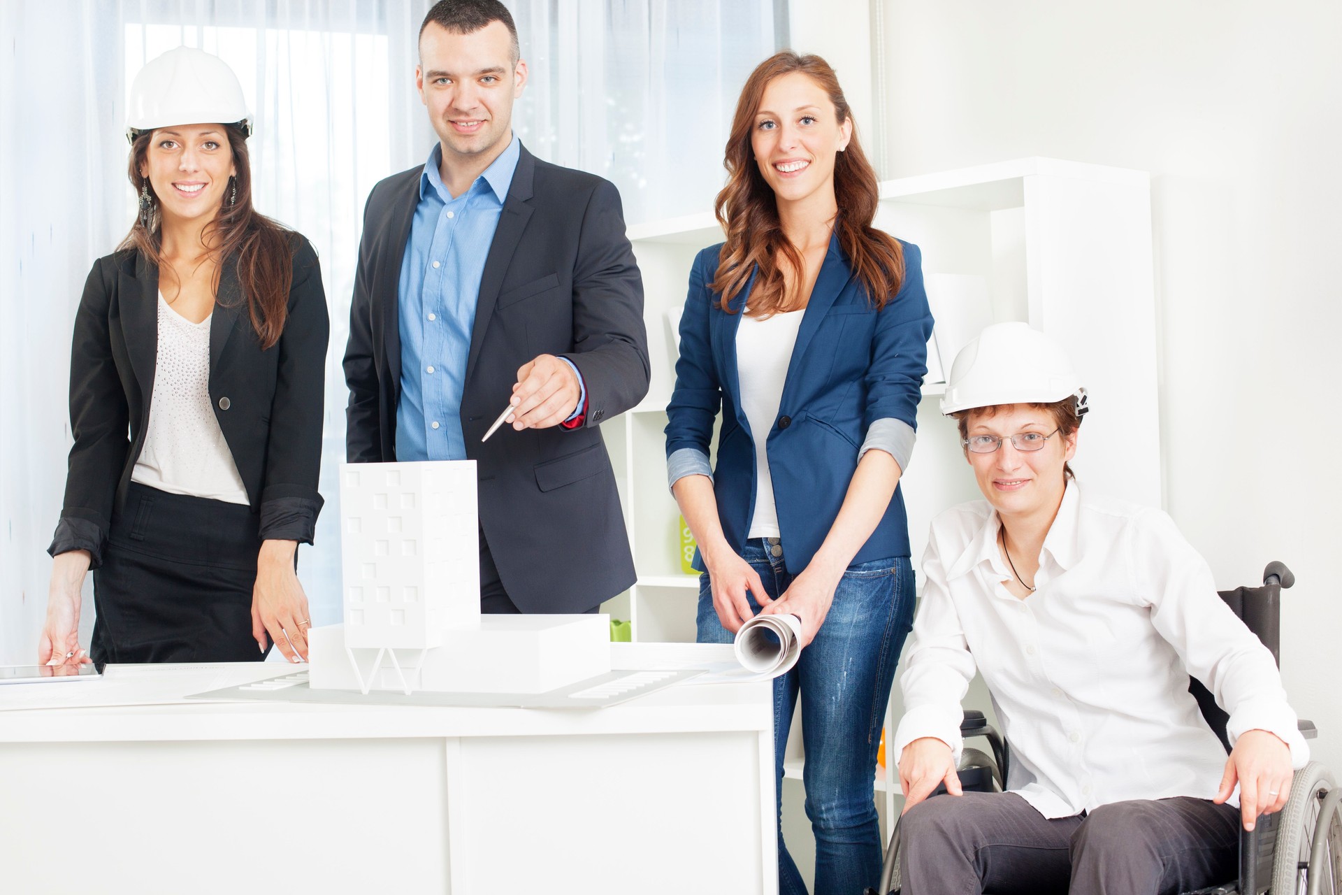 Architect Team with disabled woman in cheelchair having Meeting.